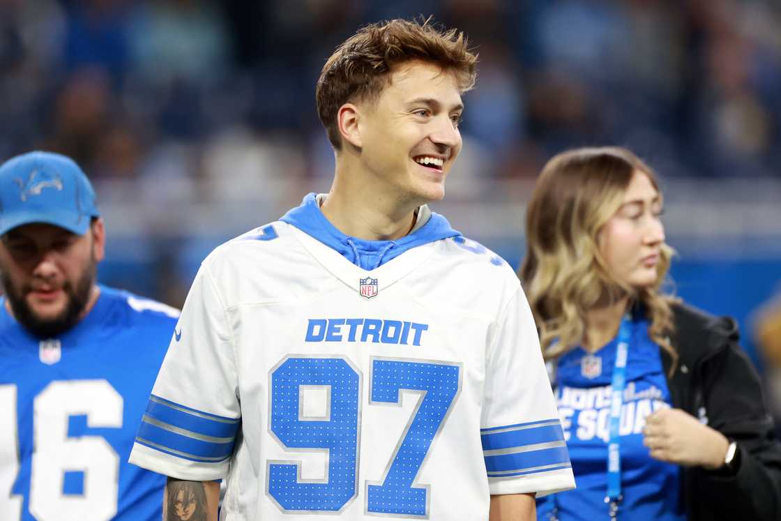 Ninja walks off the field after participating in a fan activity during a game Ninja walks off the field after participating in a fan activity during a game