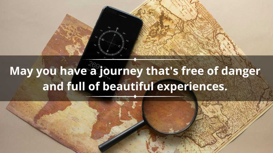 A loupe and a smartphone with a compass on maps A loupe and a smartphone with a compass on maps